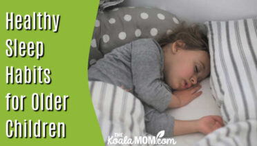 Healthy Sleep Habits for Older Children: Why Setting the Foundation Early Is so Important. Girl in grey pajamas sleeping in grey-and-white striped bedding by Isaac Quesada on Unsplash.