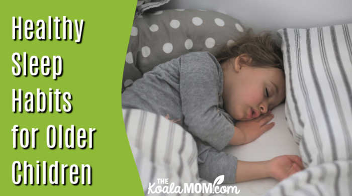 Healthy Sleep Habits for Older Children: Why Setting the Foundation Early Is so Important. Girl in grey pajamas sleeping in grey-and-white striped bedding by Isaac Quesada on Unsplash.