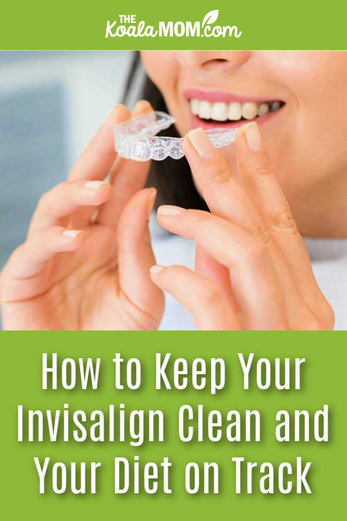 How to Keep Your Invisalign Clean and Your Diet on Track. Photo of smiling woman holding her Invisalign in front of her mouth by Arvind Philomin via Pexels.