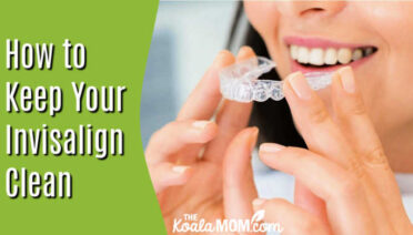 How to Keep Your Invisalign Clean and Your Diet on Track. Photo of smiling woman holding her Invisalign in front of her mouth by Arvind Philomin via Pexels.