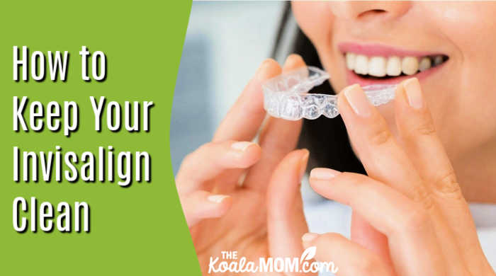How to Keep Your Invisalign Clean and Your Diet on Track. Photo of smiling woman holding her Invisalign in front of her mouth by Arvind Philomin via Pexels.