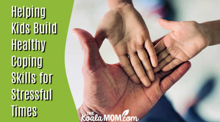 Helping Kids Build Healthy Coping Skills for Stressful Times. Photo of adult hand with two kids' hands open inside it by Chris John via Pexels.