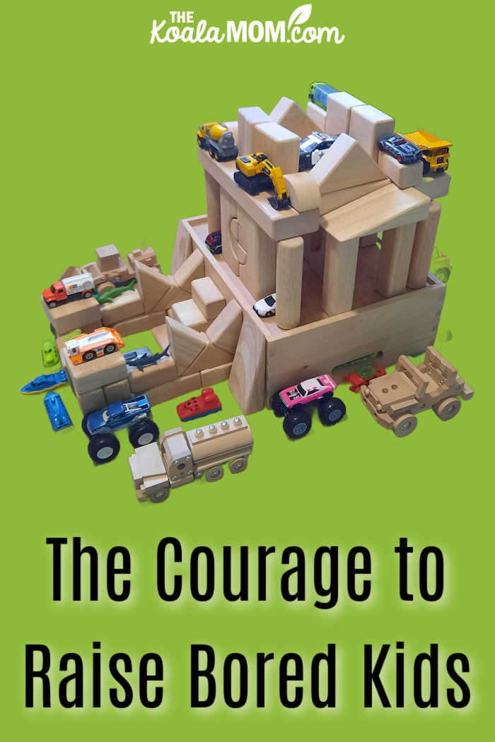 The Courage to Raise Bored Kids. Photo of wooden block tower with plastic and wooden cars and trucks around it by Bonnie Way.