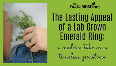 The Lasting Appeal of a Lab Grown Emerald Ring: a modern take on a timeless gemstone. Woman holding a spray of greenery, wearing a white shirt and jeans, with an emerald ring on her left hand, by carlos lopez via Pexels.