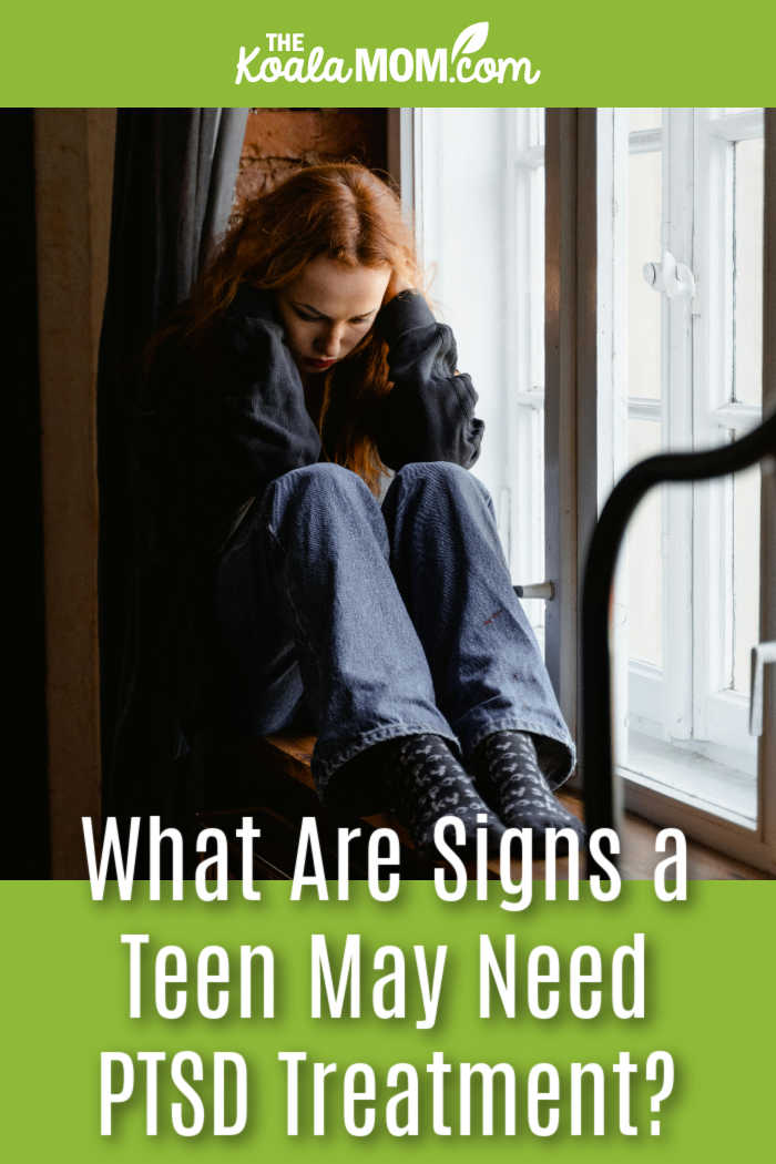 What Are Signs a Teen May Need PTSD Treatment? Photo of a girl sitting in a window seat with her hands over her ears by MART PRODUCTION via Pexels.