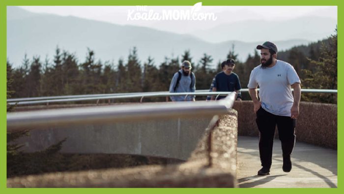 Image of family walking along sidewalk in Gatlinburg by Chin Ting Chan (purchased stock photo).