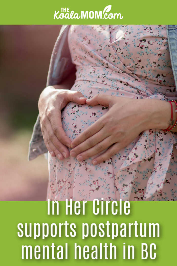 In Her Circle supports postpartum mental health in BC. Image of pregnant mom in a pink floral dress holding her hands in a heart shape over her tummy by Анастасия Триббиани via Pexels.