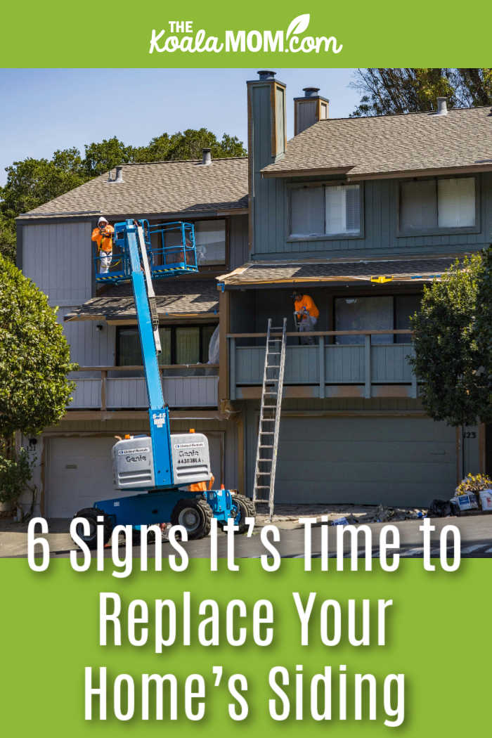 Signs It’s Time to Replace Your Home’s Siding. Photo of a renovation lift in front of a townhome by Robert So via Pexels.