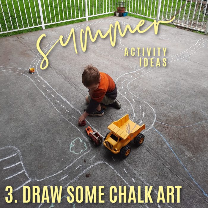 Summer activity ideas 3. draw some chalk art. Photo of a boy driving his trucks on a chalk path on a deck by Bonnie Way.