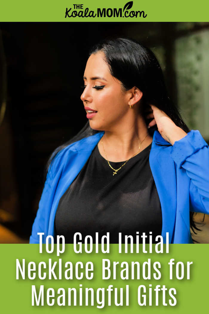 Top Gold Initial Necklace Brands for Meaningful Mother's Day and Everyday Gifts. Photo of woman with black hair and black shirt and blue blazer wearing a gold necklace with the initial T on it by K via Pexels.
