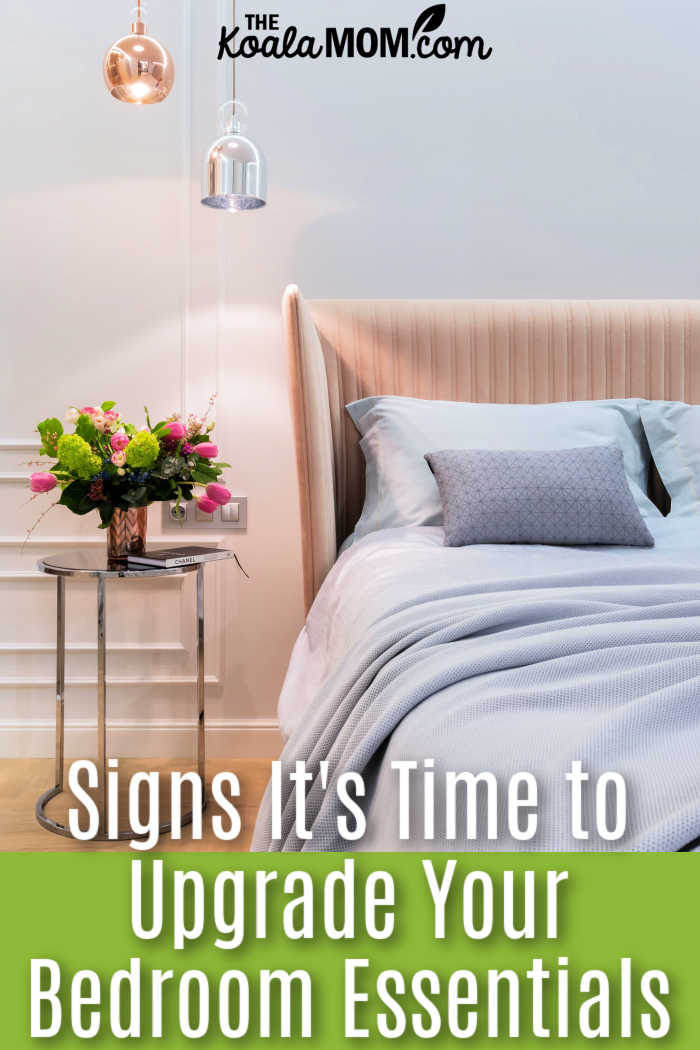 Signs It's Time to Upgrade Your Bedroom Essentials. Photo of bed with peach headboard and blue sheets and flowers on the bedside table by Max Vakhtbovych via Pexels.
