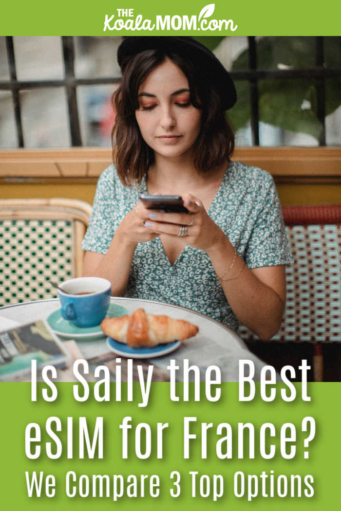 Is Saily the Best eSIM for France? We Compare 3 Top Options. Photo of woman looking at her phone while wearing a black beret and sitting a cafe table with a croissant and tea cup in front of her by Bethany Ferr via Pexels.
