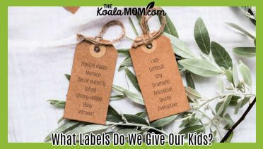 What Labels Do We Give Our Kids? Photo of two brown gift tags on some greenery on a white table cloth by Polina via Pexels.