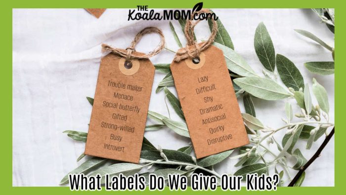 What Labels Do We Give Our Kids? Photo of two brown gift tags on some greenery on a white table cloth by Polina via Pexels.
