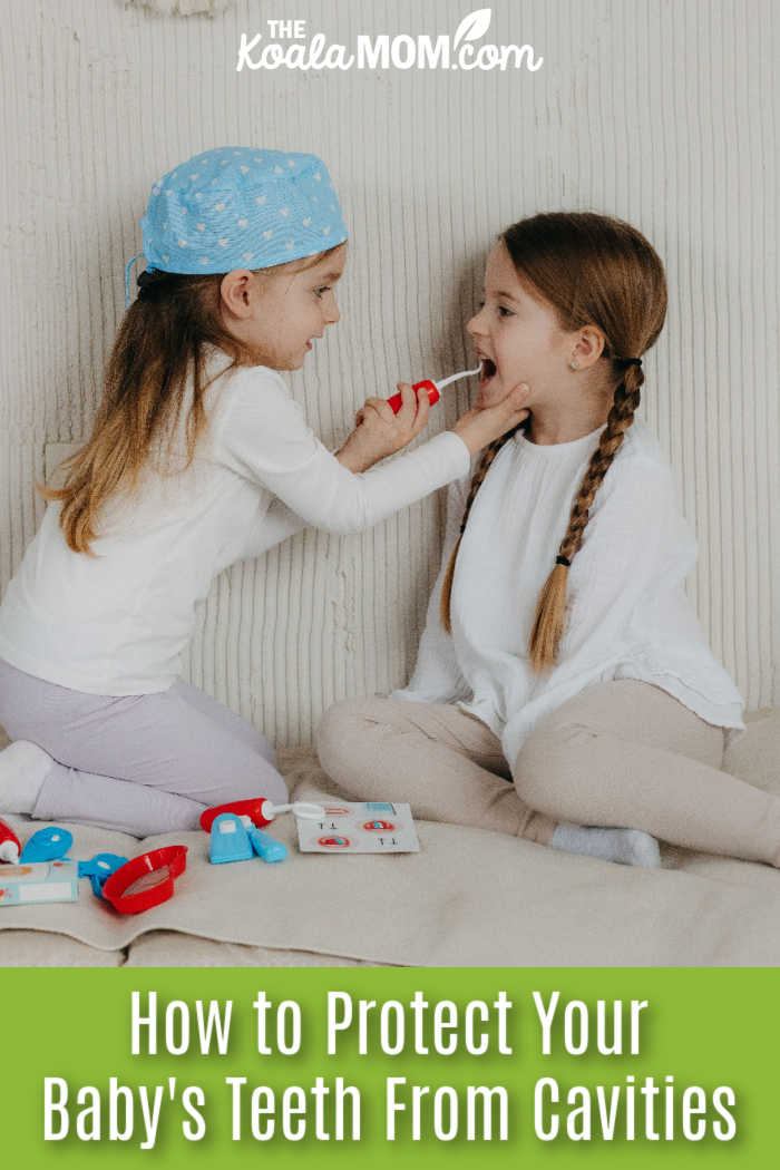 How to Protect Your Baby's Teeth From Cavities. Photo of two girls playing with a toy dental set, one checking the other girls' teeth, by Polesie Toys via Pexels.