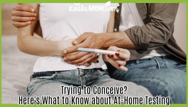 Trying to Conceive? Here's What to Know about At-Home Testing. Photo of man holding a woman who holds a pregnancy test (waists only) by Gustavo Fring via Pexels.
