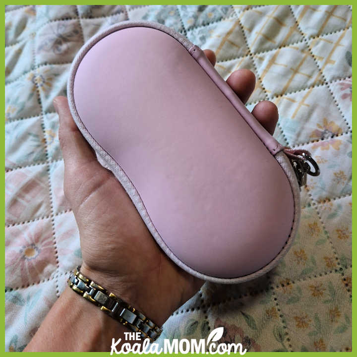 Pink hard-shell glasses case held in woman's left hand. Photo by Bonnie Way.