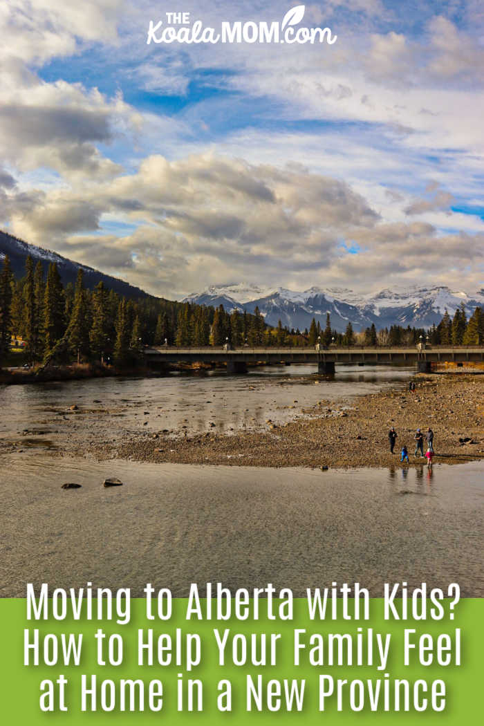 Moving to Alberta with Kids? How to Help Your Family Feel at Home in a New Province. Photo of beautiful mountain river scene in Banff, Alberta with a bridge and people in the distance by Hunter Shroeder via Pexels.