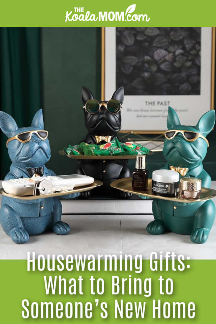 Housewarming Gifts: What to Bring to Someone’s New Home. Stock photo of three marble bulldogs wearing sunglasses and holding keys and trinkets on a side table.